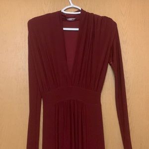 Red Long sleeve maxi dress . A bit long. Deep V neck. Stretchy material